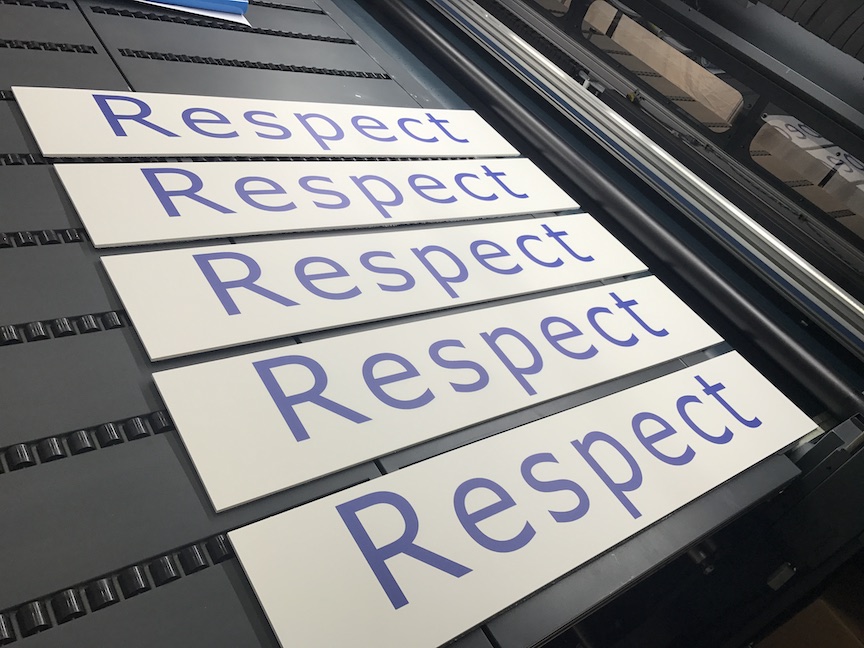 five pvc boards that say respect